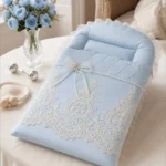 Baby sleeping in Blush Pearl Carrynest
